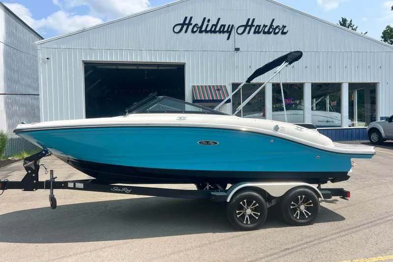 Slide: The Image of 2023 Sea Ray SPX 190 boat on trailer at Holiday Harbor dealership. - 15