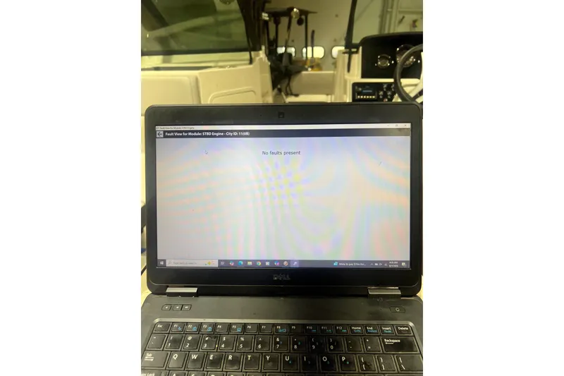Slide: The Image of Laptop displaying "No faults present" message on Sea Ray SPX 190 boat, 2023 model. - 11