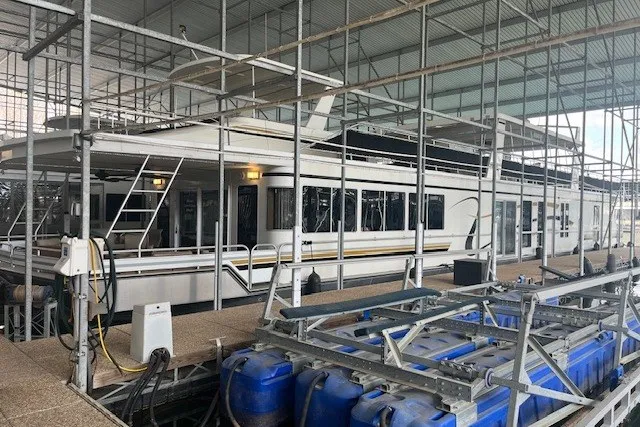 The Image of 2006 Fantasy 20x100 houseboat docked in a covered marina. - 0