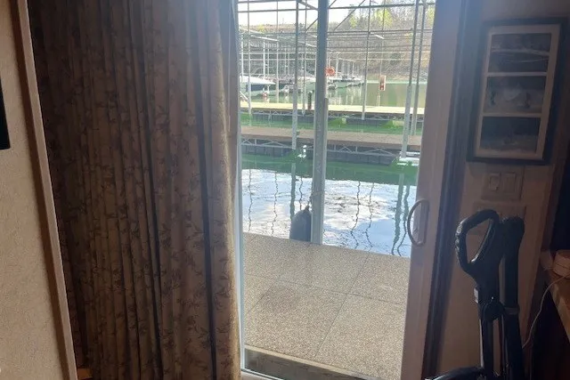 Slide: The Image of Sliding glass door opens to a flooded patio with dock view, Fantasy 20x100, 2006. - 21