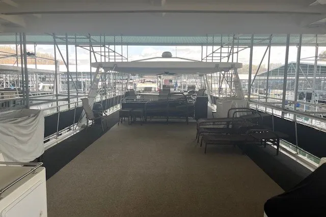 Slide: The Image of Spacious deck of a 2006 Fantasy 20x100 houseboat docked at a marina. - 66