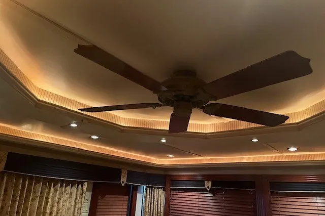 Slide: The Image of Ceiling fan with wooden blades in a warmly lit room, Fantasy 20x100 model, 2006. - 11