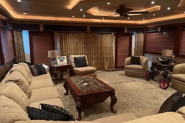 Slide: The Image of Luxurious living room with plush seating, elegant decor, and warm lighting in a Fantasy 20x100 model. - 8