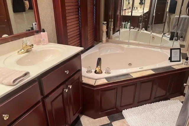 Slide: The Image of Luxurious bathroom with corner bathtub, wooden cabinets, and elegant fixtures, Fantasy model 20x100, 2006. - 50