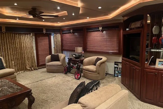 Slide: The Image of Luxurious RV interior with plush seating, wooden blinds, and elegant lighting, Fantasy 20x100, 2006 model. - 19