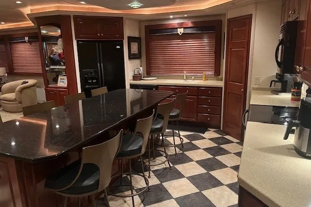 Slide: The Image of Luxurious kitchen interior in a 2006 Fantasy 20x100 model, featuring modern appliances and elegant design. - 17