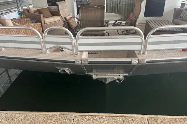 Slide: The Image of Pontoon boat deck with seating, railing, and table, Fantasy 20x100 model, 2006. - 4