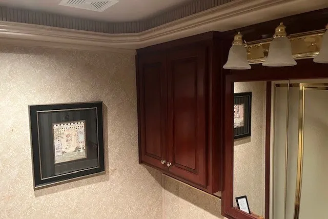 Slide: The Image of Luxurious bathroom with wooden cabinets, framed artwork, and elegant lighting fixtures, Fantasy model 20x100, 2006. - 40