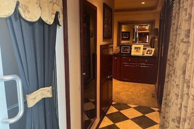 Slide: The Image of Luxurious RV interior with elegant curtains, checkered flooring, and wooden cabinetry, Fantasy 20x100, 2006. - 25
