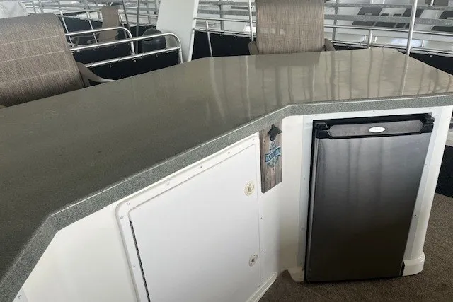 Slide: The Image of Modern boat interior with sleek countertop and compact stainless steel fridge, Fantasy 20x100, 2006 model. - 58