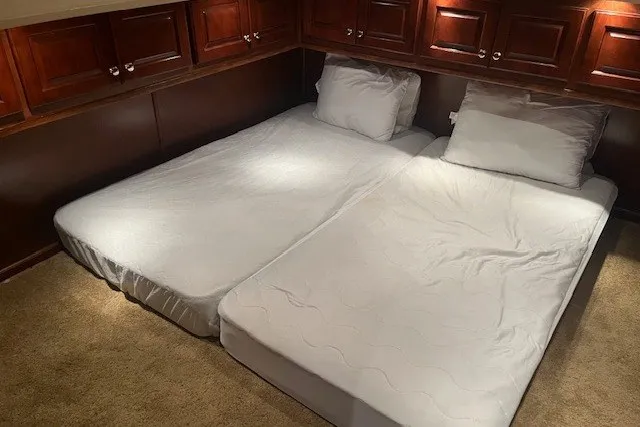 Slide: The Image of Two white mattresses in a cozy room with wooden cabinets, Fantasy 20x100, 2006 model. - 42