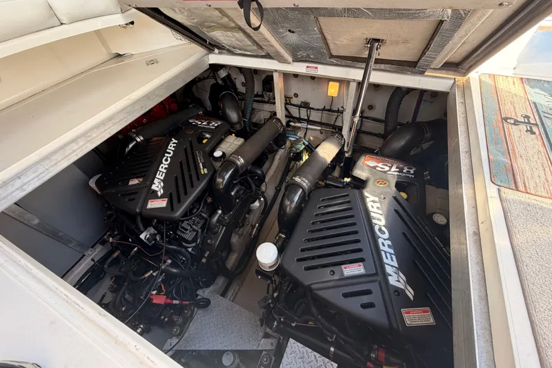 Slide: The Image of Engine compartment of a 2003 Sea Ray 380 Sundancer with Mercury engines. - 28
