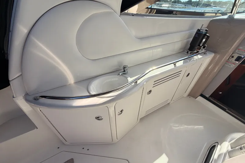 Slide: The Image of 2003 Sea Ray 380 Sundancer yacht interior with sink and storage cabinets. - 11