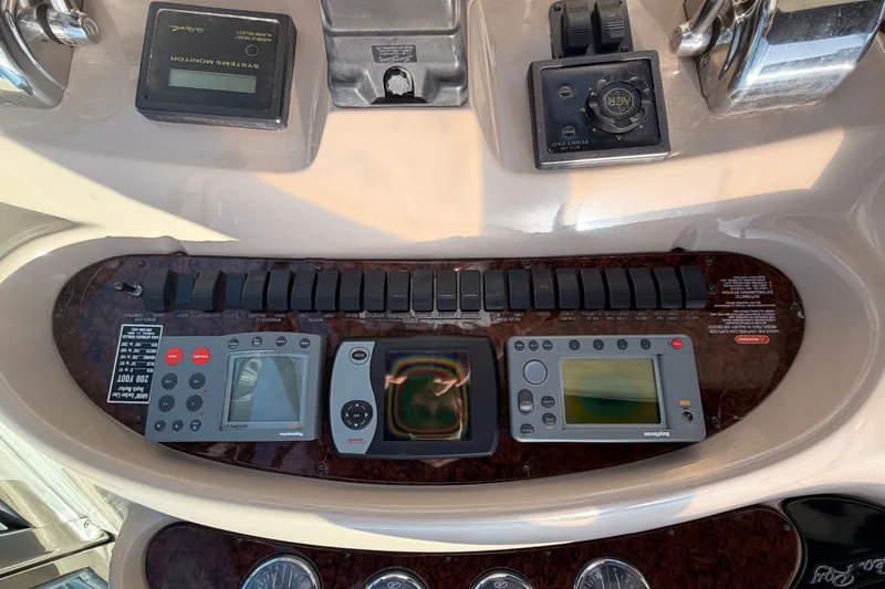 Slide: The Image of Control panel of a 2003 Sea Ray 380 Sundancer boat with navigation instruments. - 15