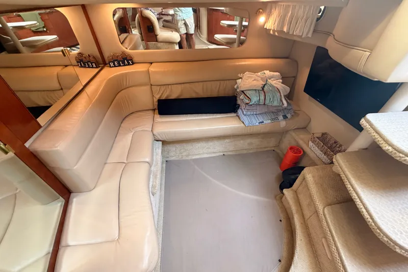 Slide: The Image of Luxurious interior of 2003 Sea Ray 380 Sundancer yacht with beige leather seating. - 17