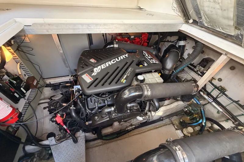 Slide: The Image of Engine compartment of a 2003 Sea Ray 380 Sundancer with Mercury engine. - 27