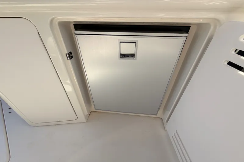 Slide: The Image of Built-in refrigerator on a 2003 Sea Ray 380 Sundancer yacht, featuring sleek design. - 12