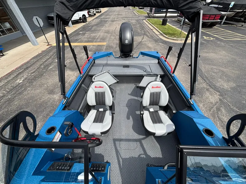 Slide: The Image of The image shows a 2027 SeaArk Protege 200 boat with two seats and an outboard motor. - 16