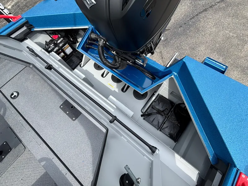 Slide: The Image of The image shows the stern of a SeaArk Protege 200 boat with an outboard motor and storage space. - 23