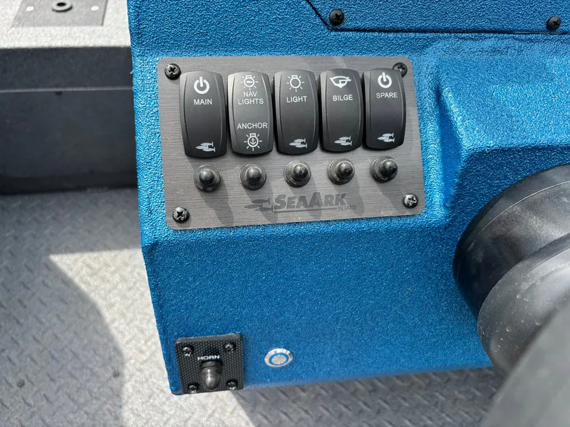 Slide: The Image of Close-up of a blue control panel with switches for main power, nav lights, anchor, bilge, and spare. - 20