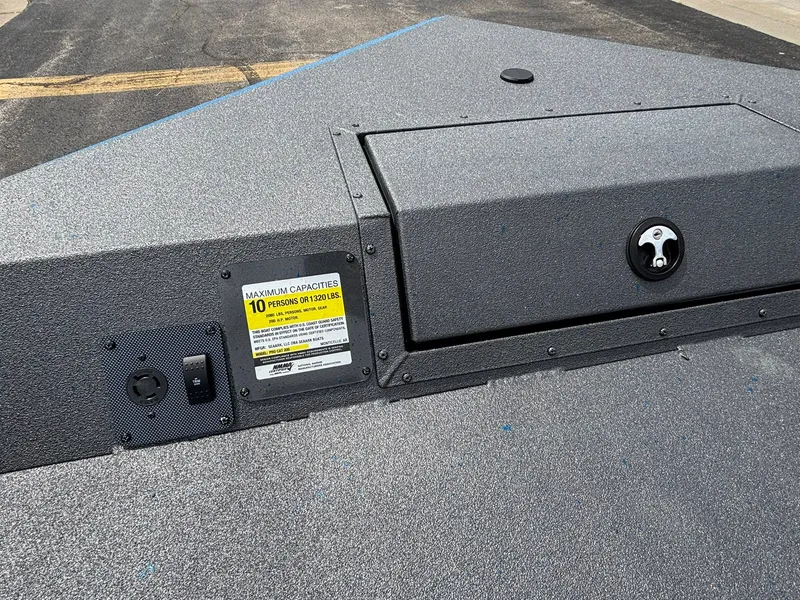 Slide: The Image of The image shows the deck of a SeaArk Protege 200 boat with a capacity plaque. - 15