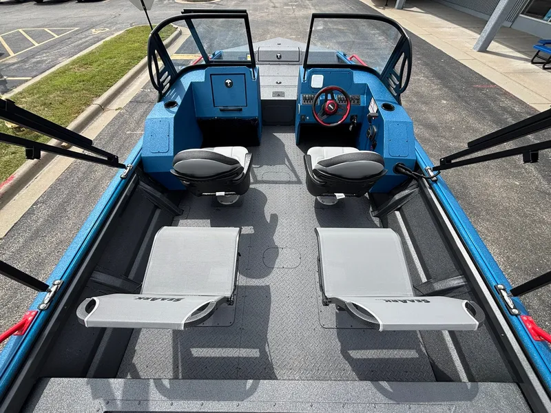 Slide: The Image of The image shows the interior of a 2027 SeaArk Protege 200 boat with four seats. - 17