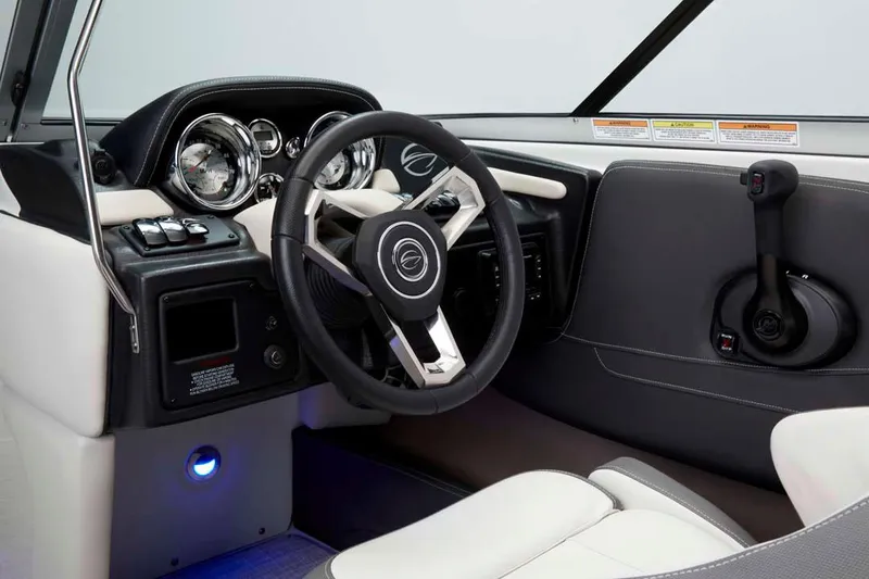 Slide: The Image of Manufacturer Provided Image: 2026 Crownline 200 SS boat interior with modern steering wheel and dashboard controls. - 14