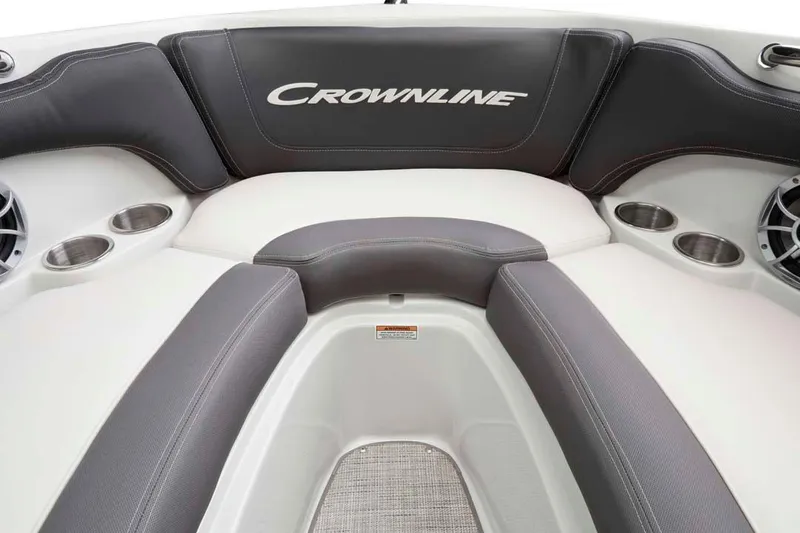 Slide: The Image of Manufacturer Provided Image: 2026 Crownline 200 SS boat interior with cushioned seating and cup holders. - 13