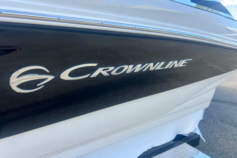 Slide: The Image of 2027 Crownline 200 SS boat side view with logo and sleek design. - 4