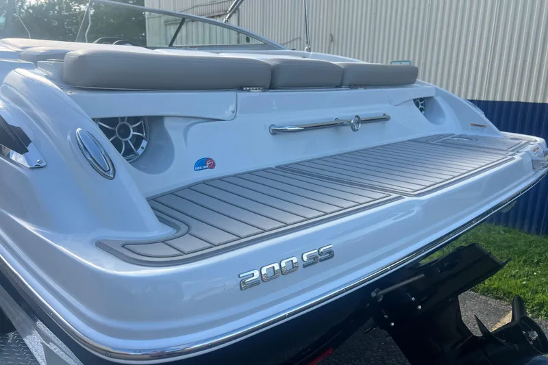 Slide: The Image of 2027 Crownline 200 SS boat rear view with swim platform and speakers. - 1