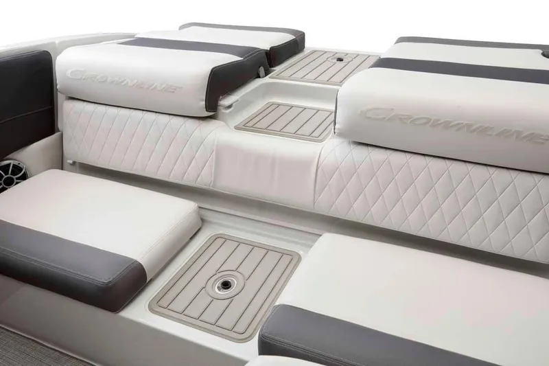 Slide: The Image of Manufacturer Provided Image: 2026 Crownline 200 SS boat interior with cushioned seating and storage compartments. - 17