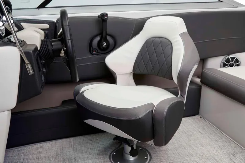 Slide: The Image of Manufacturer Provided Image: 2026 Crownline 200 SS boat interior with modern steering and cushioned seating. - 15