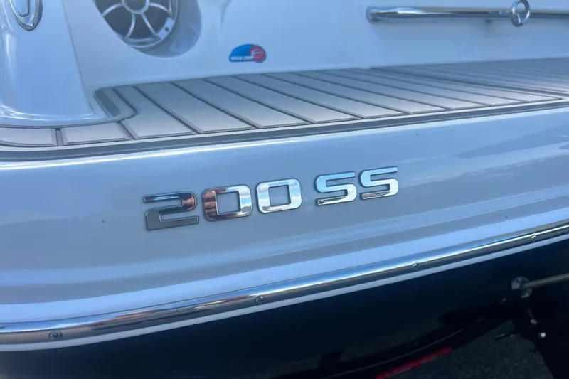 Slide: The Image of 2027 Crownline 200 SS boat rear view with model emblem and speaker detail. - 7