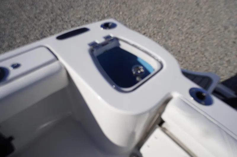 Slide: The Image of 2026 Tidewater 232 CC Adventure boat interior with open compartment. - 51