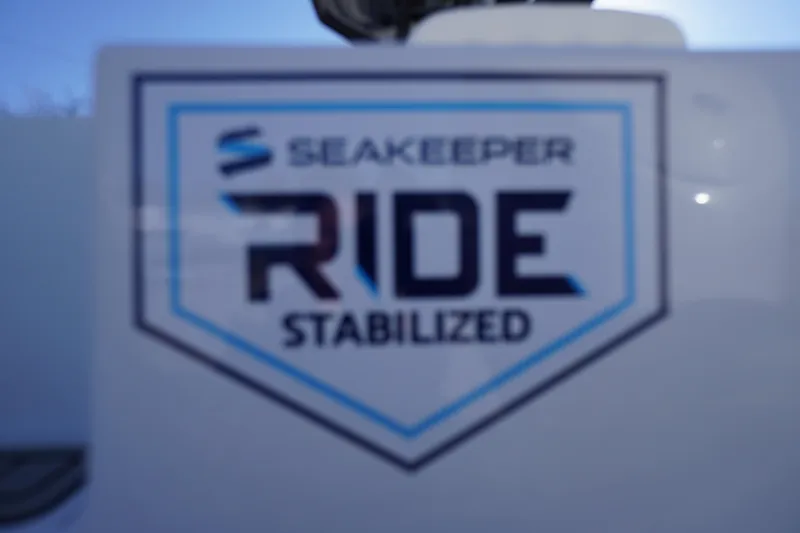 Slide: The Image of Seakeeper Ride Stabilized logo on 2026 Tidewater 232 CC Adventure boat. - 56