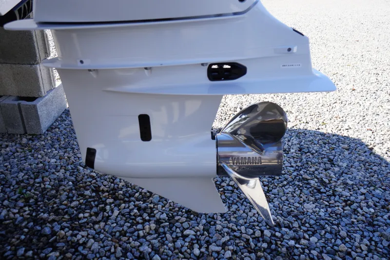 Slide: The Image of Outboard motor of 2026 Tidewater 232 CC Adventure on gravel surface. - 60
