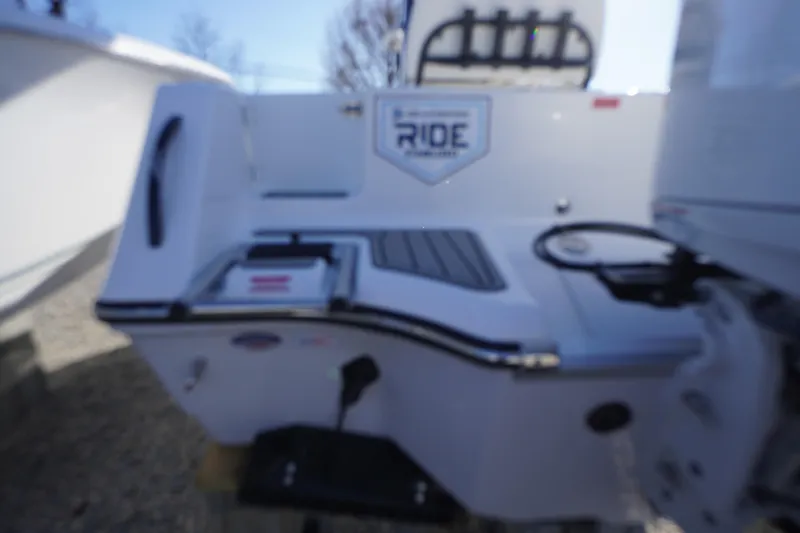 Slide: The Image of 2026 Tidewater 232 CC Adventure boat, rear view with fishing rod holders. - 62