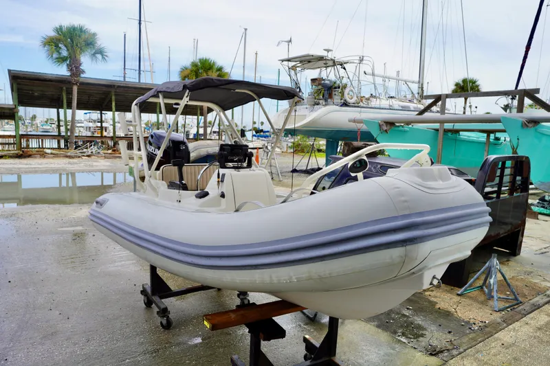 Slide: The Image of 2002 AB Inflatables Nautilus 11 DLX boat on stand at marina. - 1