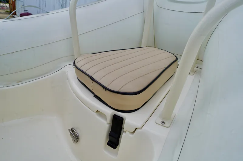 Slide: The Image of 2002 AB Inflatables Nautilus 11 DLX boat seat with beige cushion and white frame. - 2