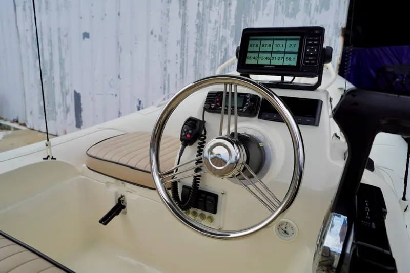 Slide: The Image of Steering console of 2002 AB Inflatables Nautilus 11 DLX with navigation equipment. - 6