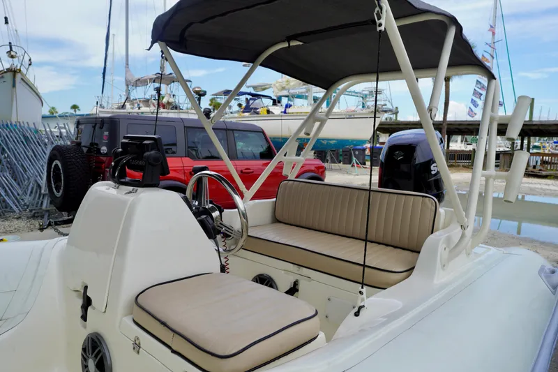 Slide: The Image of 2002 AB Inflatables Nautilus 11 DLX boat interior with seating and steering console. - 16