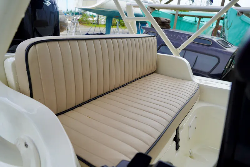 Slide: The Image of 2002 AB Inflatables Nautilus 11 DLX boat interior with beige cushioned seating. - 11