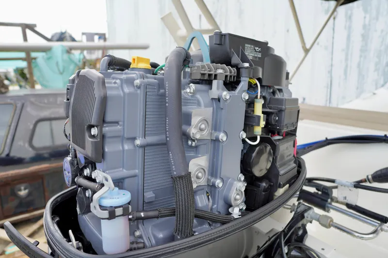 Slide: The Image of Close-up of a 2002 AB Inflatables Nautilus 11 DLX boat engine, showcasing intricate mechanical details. - 20