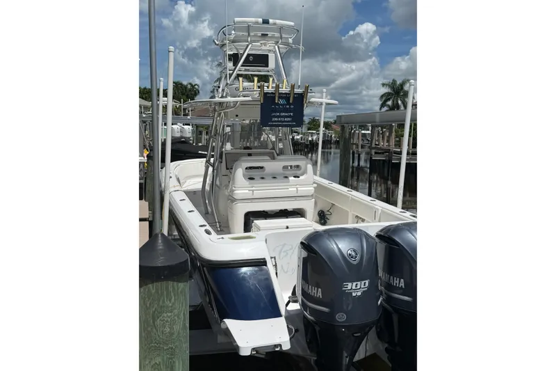 Slide: The Image of 2014 Intrepid 327 Center Console boat with twin Yamaha 300 engines docked. - 6