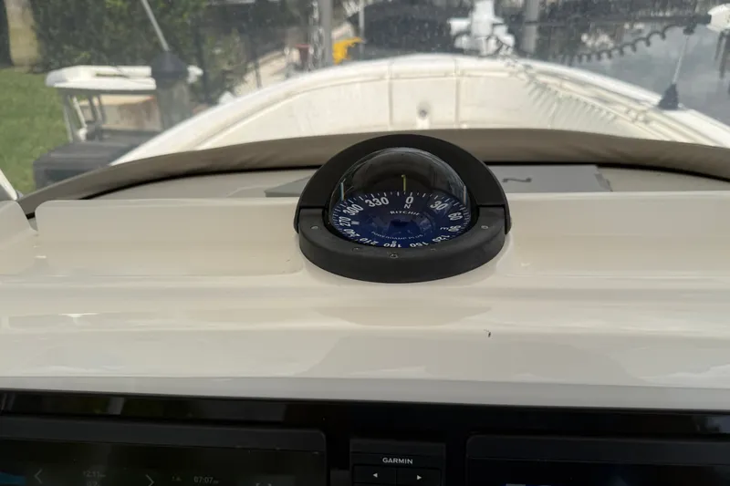 Slide: The Image of Compass on 2014 Intrepid 327 Center Console boat dashboard. - 23