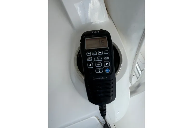 Slide: The Image of ICOM CommandMic on 2014 Intrepid 327 Center Console boat dashboard. - 25