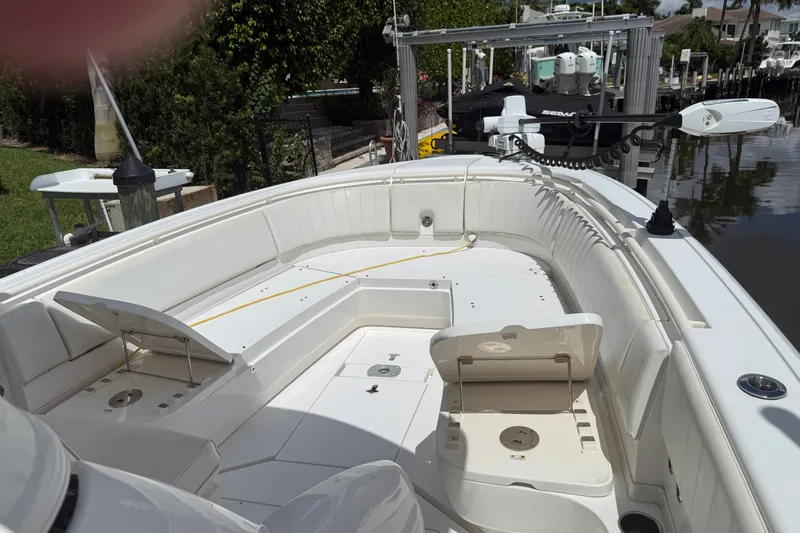 Slide: The Image of 2014 Intrepid 327 Center Console boat with spacious seating and storage compartments. - 7