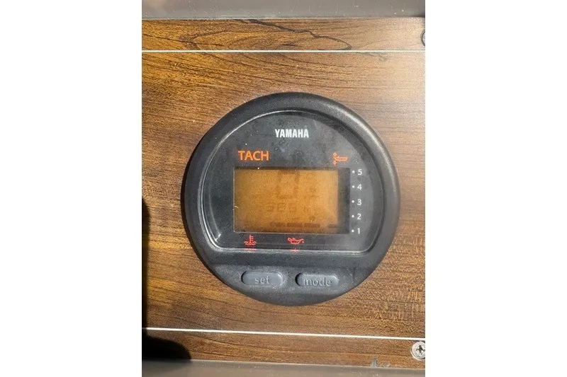 Slide: The Image of Yamaha tachometer on 1987 Grady White 22 Sea Farer boat dashboard. - 23