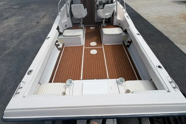 Slide: The Image of 1987 Grady White 22 Sea Farer boat interior with wooden deck and seating. - 12