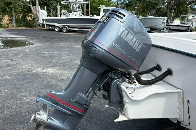 Slide: The Image of 1987 Grady White 22 Sea Farer with Yamaha outboard motor in a parking lot. - 11